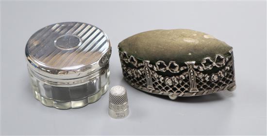 An Edwardian pierced silver mounted navette shaped pin cushion, Henry Matthews, Birmingham, 1904, a silver thimble and a toilet jar.